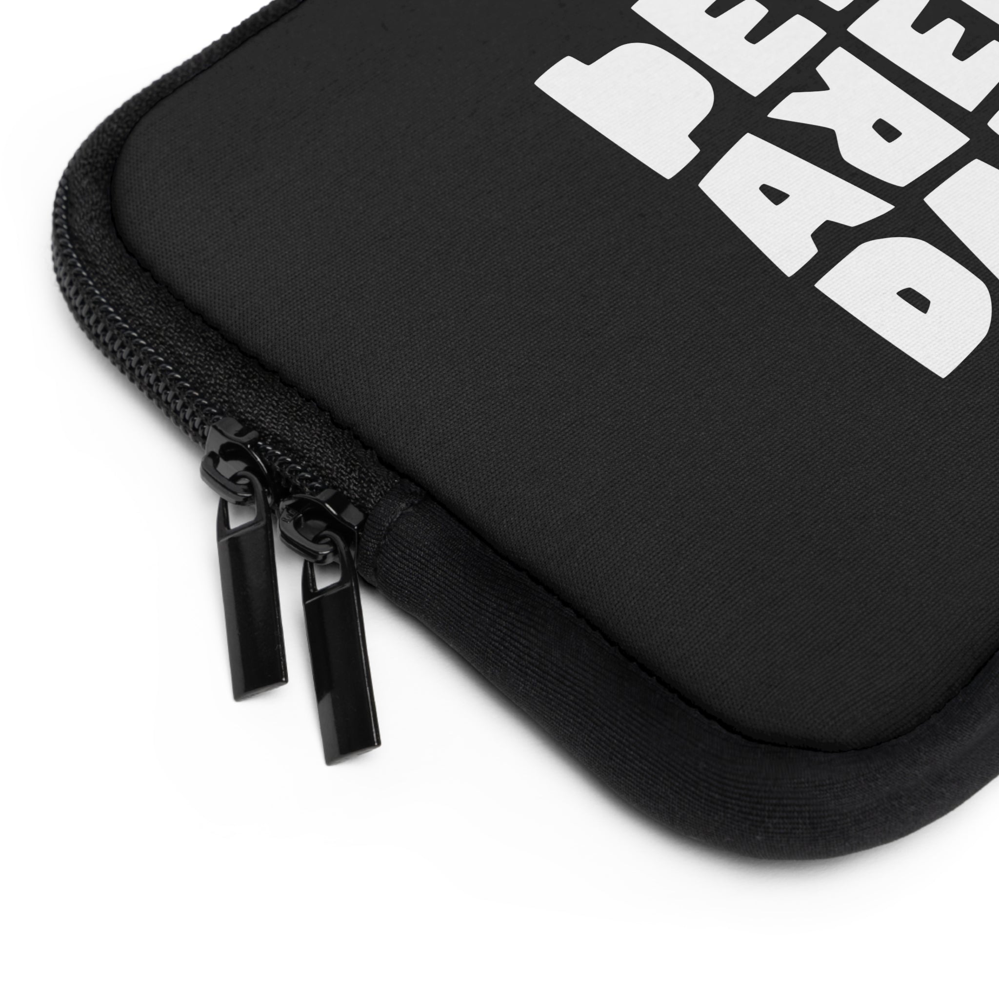 Close-up of the Printify "Copy of Copy of Laptop Sleeve," featuring a black, water-resistant design with two metal zipper pulls and partially visible bold white block text on the fabric.