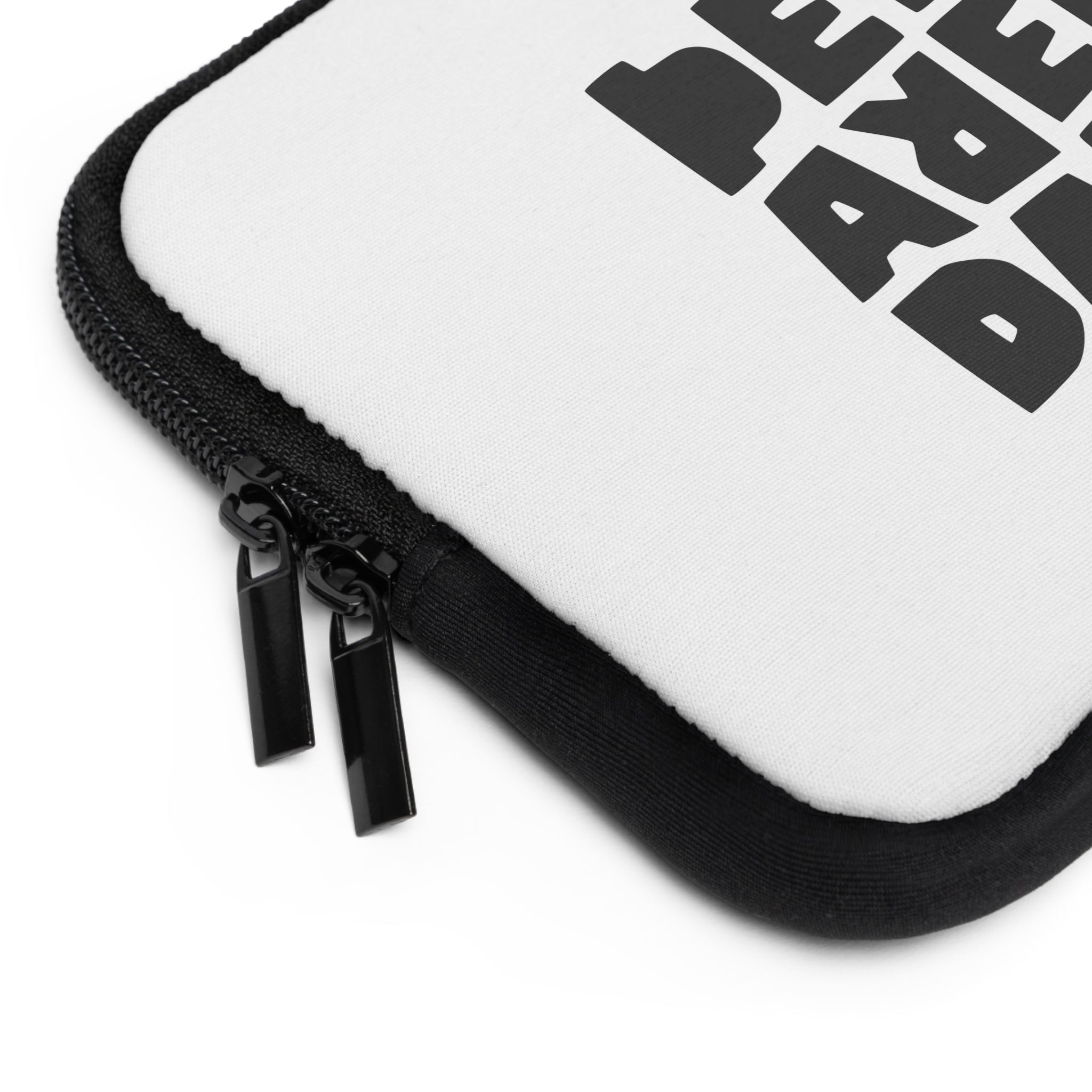 Close-up of a Printify Laptop Sleeve in white with black edges and two black zipper pulls; features partial bold black text on the case and is water resistant.