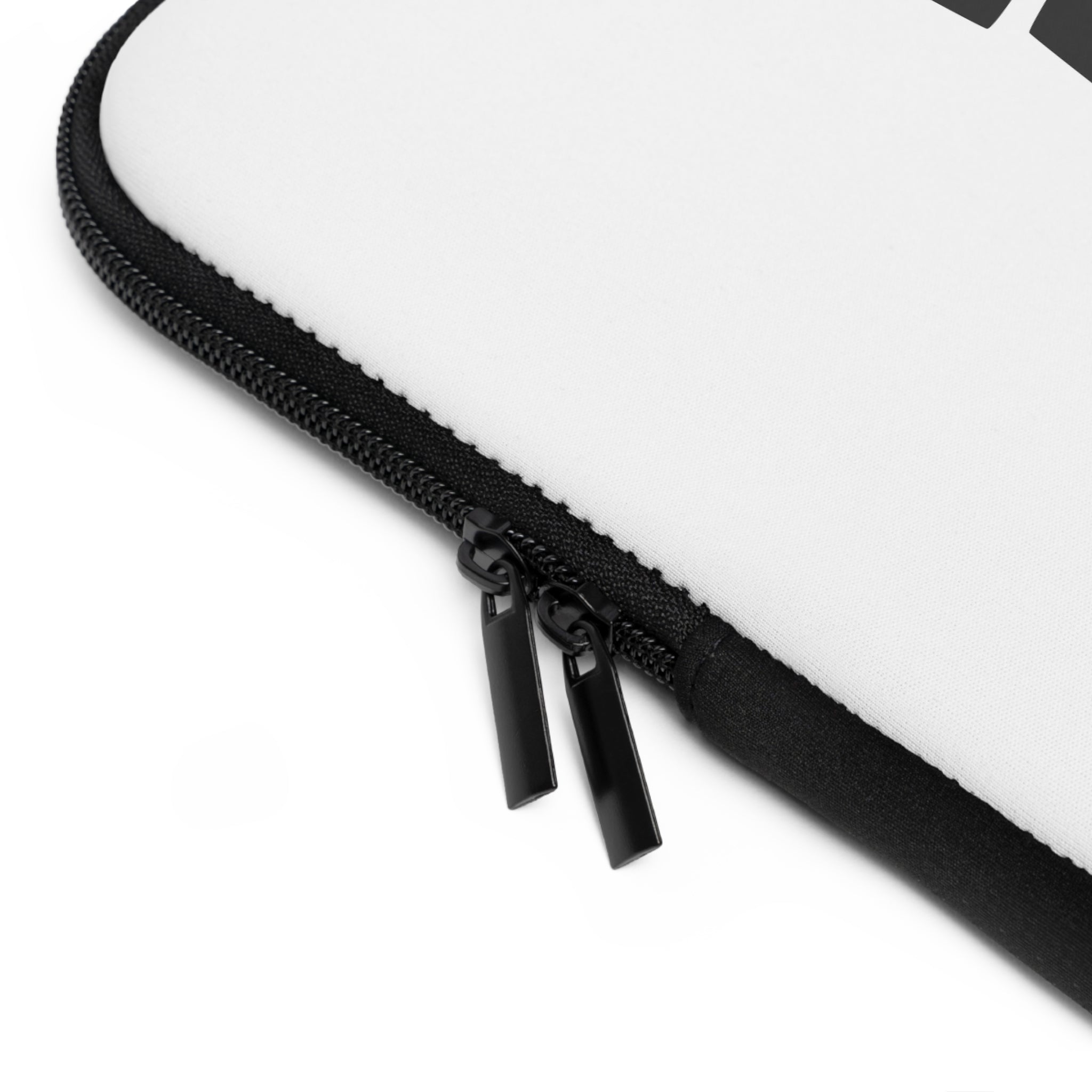 Close-up of a Printify Laptop Sleeve in white, featuring water-resistant material, black trim along the edge, and two black zipper pulls.