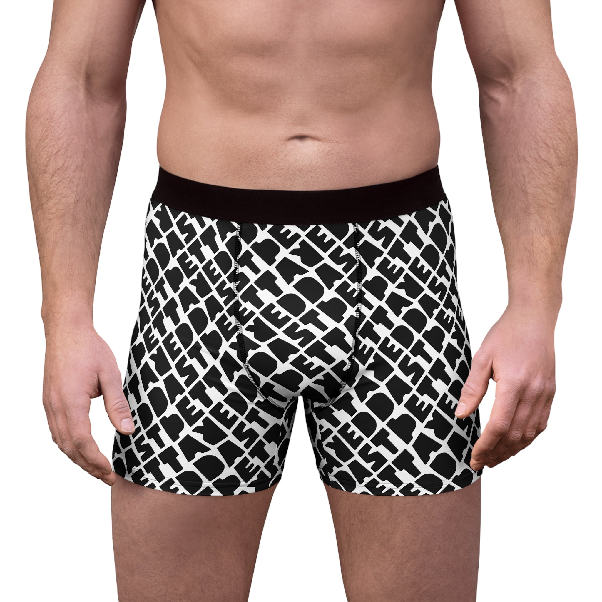 A man stands facing forward, shown from mid-thigh to waist, wearing Printify Men's Boxer Briefs (AOP) with a black and white pattern.