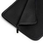 Close-up of the Printify Laptop Sleeve in black, featuring soft, water-resistant material and a partially unzipped design that reveals the inner lining.