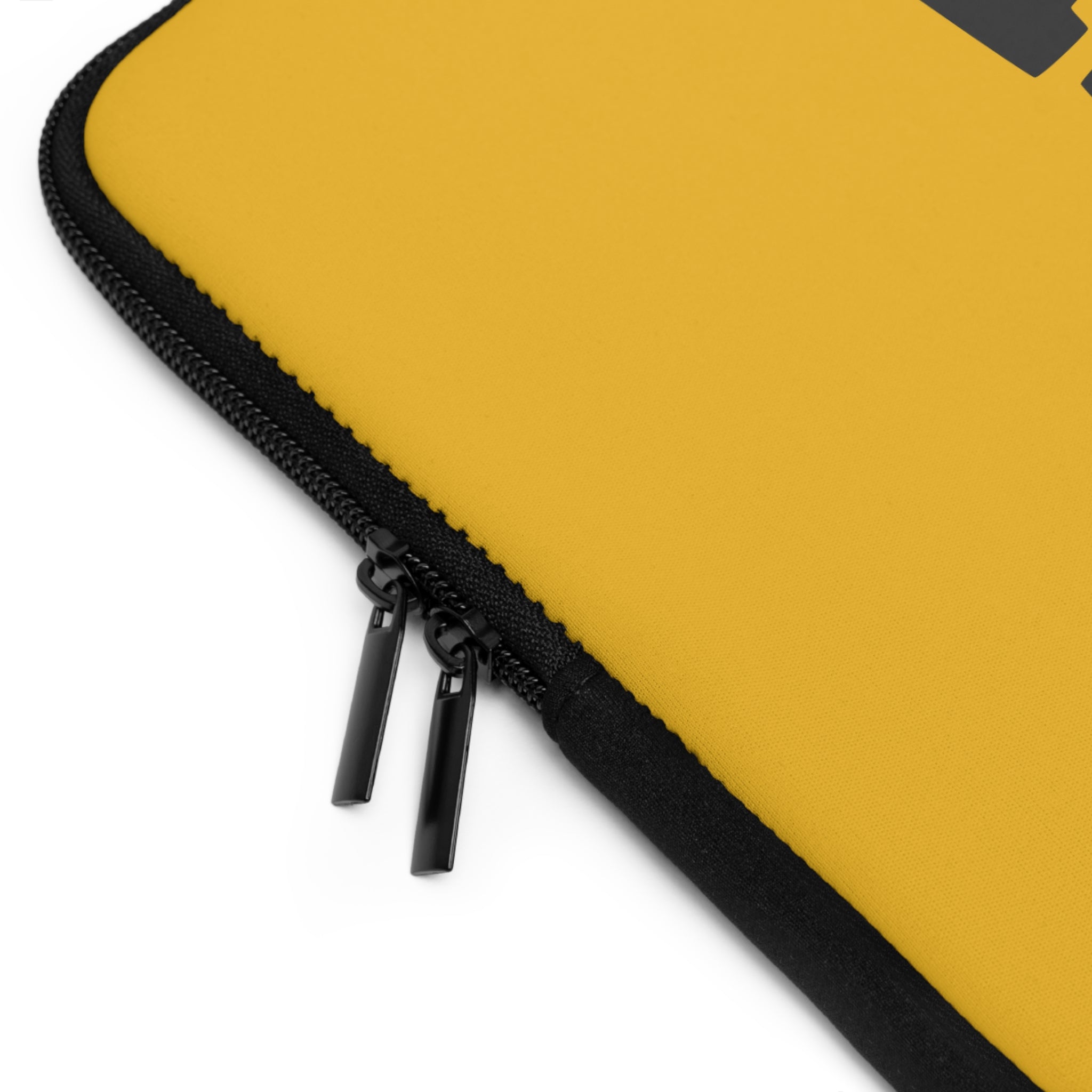 Close-up of a black zippered edge with two zipper pulls on the yellow water-resistant "Copy of Laptop Sleeve" by Printify.
